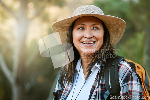Image of . Hiking, adventure and exploring with a mature female hiker enjoying a walk or hike in the forest or woods outside. Senior woman walking on a journey of discovery in nature in the great outdoors.