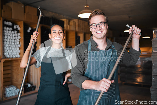 Image of Wine making workers with press tool or equipment inside a cellar, winery or distillery warehouse with bulk quality alcohol. Woman, man or sommelier people with smile portrait for industry background