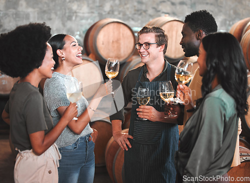 Image of Group of friends wine tasting at a distillery or cellar drinking glasses and enjoying the tour together. Happy, carefree and diverse people bonding and having fun at a winery estate