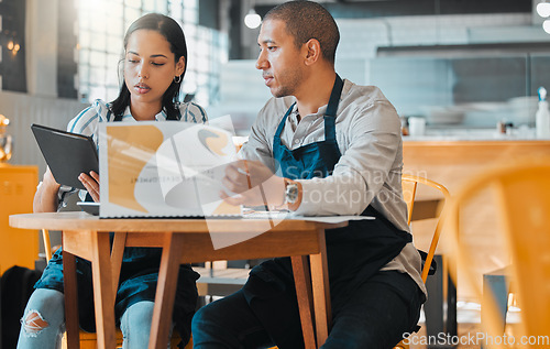 Image of Cafe store owners planning budget, finance coffee shop innovation strategy and documents in teamwork. Startup man and woman in small business meeting, discuss restaurant financial goal and vision.