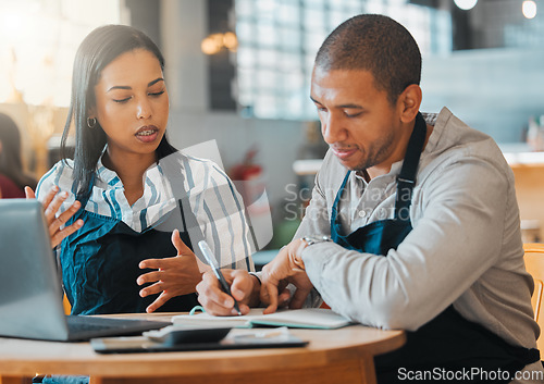 Image of Small business owners discussing and planning startup growth, budget and expenses in the cafe or coffee shop. Entrepreneurs having a financial discussion about the business finance strategy