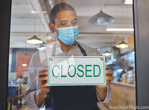 Image of Covid financial crisis, business closure and lockdown due to recession, startup failure and bankruptcy. Broke cafe worker with closed sign on window for poor economy, store shutdown and pandemic