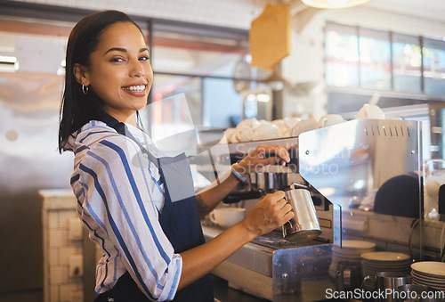 Image of Barista preparing drink in coffee shop, cafe startup and hospitality restaurant. Portrait of friendly waitress, happy bistro worker and young woman steaming milk for hot cappuccino and waiter service