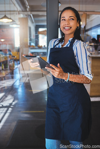 Image of Startup, management and cafe owner online order on digital tablet doing inventory, happy and checking stock. Smiling woman enjoying her job, looking proud and ambitious at a new small business