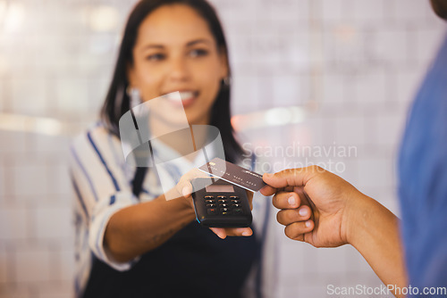 Image of Credit card, payment and customer with an electronic reader in the hand of a cashier to process a fintech purchase or money spend. Consumer making a banking or finance transaction in a coffee shop
