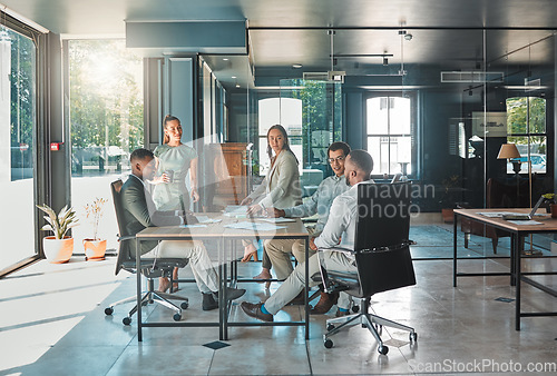 Image of Corporate business meeting, team collaboration and strategy planning in a startup company. Office workers, diversity employees and workforce having discussion, brainstorm and speaking in an agency