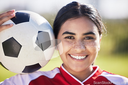 Image of Training, football and portrait of a sporty woman face and soccer ball, enjoying sport and a healthy lifestyle at a field or park. Happy player having fun with fitness, being active and carefree