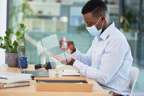 Image of Hygiene, compliance and covid rules at work with a business man sanitize hands before a shift. Professional male worker cleaning hand before going online with marketing project or design