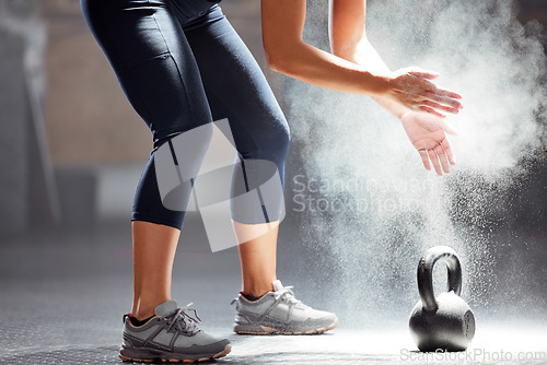 Image of Fit, dust, kettle bell of female in fitness clapping hands of chalk in the gym. Healthy, wellness and athletic woman preparing for training exercise or workout, motivation and sports.