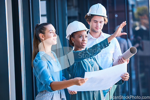 Image of Building construction management team with an architect and engineering blueprint. Teamwork development collaboration of industrial engineer group planning a architecture renovation project