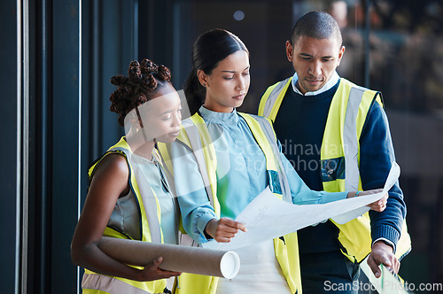 Image of Construction, architect plans and diverse engineers consulting and planning a design as a team. Group of creative, professional and successful industry workers analyzing architecture documents.