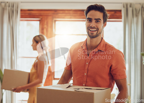 Image of Happy couple moving into new home, people carrying boxes to property and relocating to apartment together. Portrait of smiling, cheerful and handsome man packing for move with woman standing at house