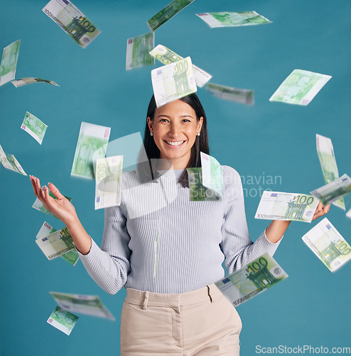 Image of Wealthy, rich and money rain or falling from the sky for financial success and growth. Portrait of a successful, happy and excited female catching cash and enjoying finance investment or lottery win