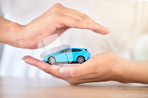 Image of .Car insurance, finance and travel safety model size motor vehicle covered, security and protected by hands. Financial, toy automobile and transportation loan assurance for trustworthy service help.