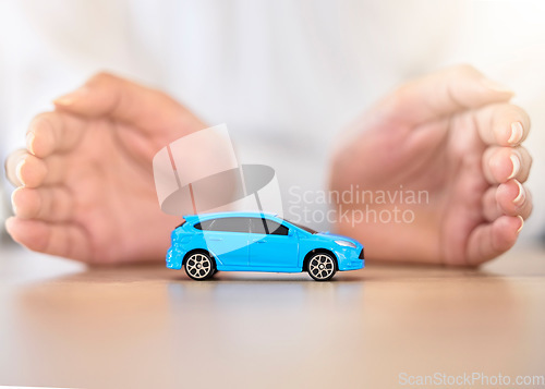 Image of .Hands, car and insurance with a business employee covering transport with her hands in her company office. Finance, saving and transportation with a broker offering to secure your vehicle at work.