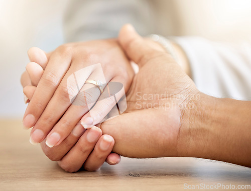 Image of .Couple engagement with hands holding and presenting a diamond ring for a save the date announcement. Love, hope and trust between a man and woman with jewelry ready for a future wedding celebration.