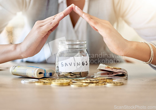 Image of Savings, investment and insurance cover business woman with coins, money and cash in a jar for future plan or personal growth development or housing. Closeup hands covering bank or mortgage expenses