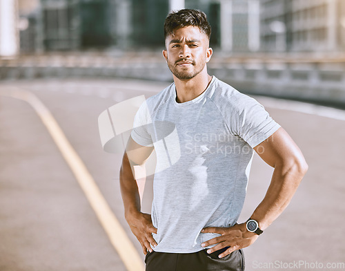 Image of Fitness, sports and runner with motivation, wellness goals and vision in city, town or dowtown. Portrait of active, athletic or healthy man on street for routine running workout, exercise or training