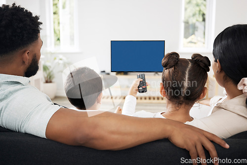 Image of Blue screen, chroma key tv with a relax family watching and enjoy streaming movies, series and entertainment copy space. Back view of parents and kids spending leisure time viewing television