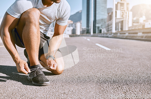 Image of Tie shoes, wellness and fitness male runner ready for run, exercise and workout or cardio training. Healthy, fit and active male jogger preparing for jogging, exercising or physical activity