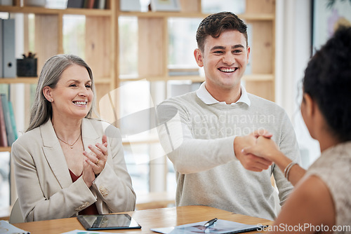 Image of Happy business people shaking hands, meeting and greeting in an office. Happy professional talking to his boss about a promotion or job. Hr congratulating ambitious employee, clapping and celebrating