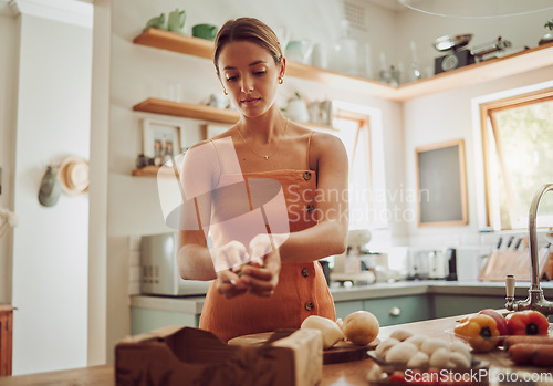 Image of Healthy, organic and fresh food and vegetables ready for cooking with a young woman in a kitchen. Female nutritionist ready to make a nutrition, weight loss and health diet meal for dinner at home