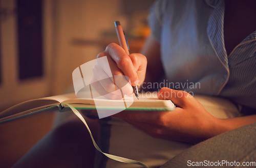 Image of Creative writing at home by female hands enjoying a calm, peaceful day off indoors. Woman making notes in a journal, expressing her feelings and thoughts while making a note of a personal experience