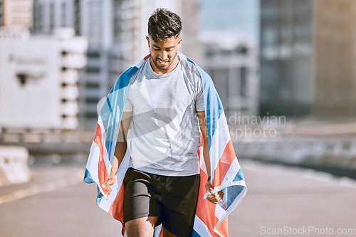 Image of Fitness, training and workout with a sports man in a british flag running a marathon in the city. Health, exercise and wellness with an olympic athlete or runner exercising for cardio and endurance