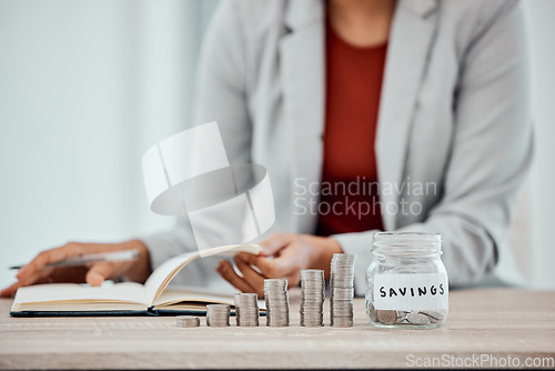 Image of Accounting business woman counting her personal savings at home, planning budget to pay bills for the month. Finance savvy and professional female writing in a financial diary for investment funds