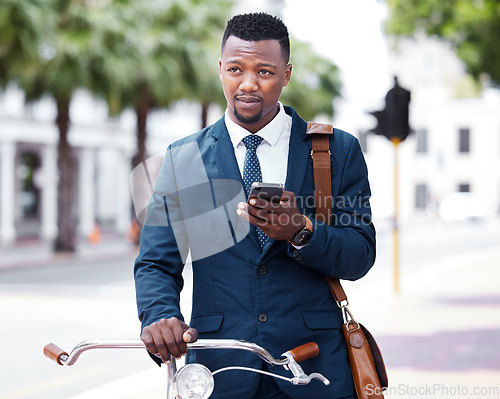 Image of Phone, business and bike with a business man on his morning commute into work in the city. Businessman on the internet with 5g mobile technology on bicycle travel to decrease his carbon footprint