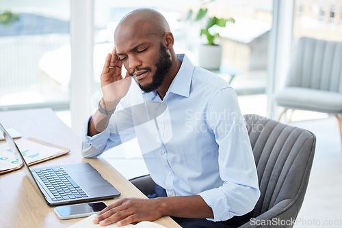 Image of Burnout, headache and stressed businessman working on laptop with problem, bad mental health or stressful job. Male manager rubbing head and feeling overworked, tired or exhausted at web tech company