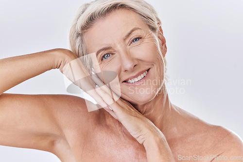 Image of Skincare, clean and happy senior woman face resting on hands in a studio portrait. Elderly beauty skin care model posing or showing bedtime routine for perfect, healthy looking or wrinkle free aging