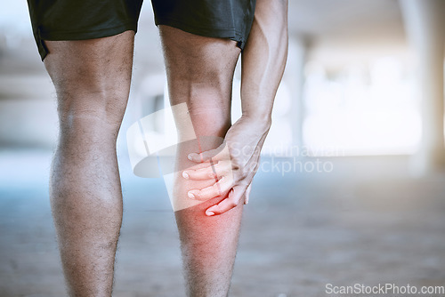 Image of Sports man hand on a leg injury while training, exercise or workout. Red graphic to identify muscle ache or pain in the body after running accident outdoor. Athlete hurt after cardio fitness routine