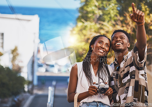 Image of Photographer couple on summer vacation or holiday abroad and tourism with lens flare, ocean and street background. Black people, man and woman looking at tourist destination for travel photography