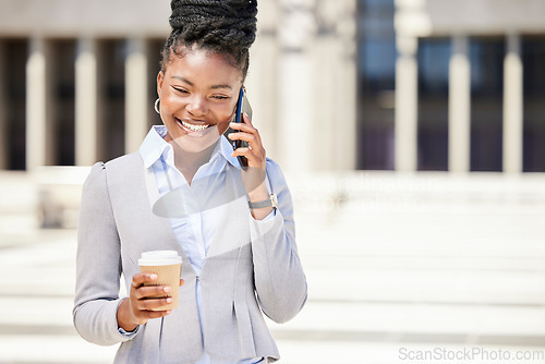 Image of Happy business woman on a phone call and drinking coffee while outside in the city, happy and confident. Young entrepreneur planning with investors, discussing strategy and innovative idea