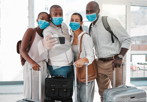 Image of Covid immigration by tourists or friends taking a selfie at the airport together before the trip, holiday or vacation during covid. A group of people takes a picture or photo while they travel