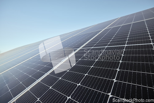 Image of Renewable, clean and green energy with solar panels for future eco electricity from the sun against a blue sky mockup. Photovoltaic power system converting sunlight through cells for sustainability