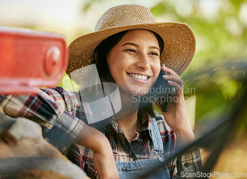 Image of Agriculture, sustainability and farmer talking on phone call on a break while working on a farm. Happy sustainable farmland worker or agro woman having mobile conversation in the countryside