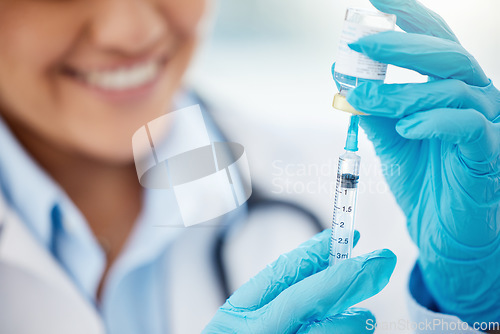 Image of Doctor extracting medication from medicine vial with syringe in hospital or healthcare professional working at clinic. Vaccine treatment, or covid flu shot for sickness and medical nurse smiling.