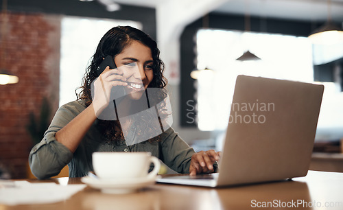 Image of Freelance, entrepreneur or small business owner talking, networking and plans on a phone call while reading emails on a laptop. Female remote worker in a cafe or coffee shop with wireless technology