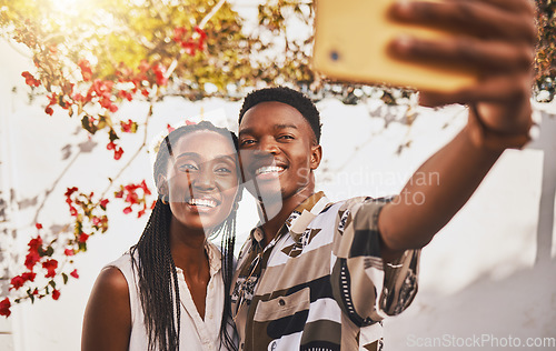 Image of Man and woman love taking a selfie portrait together as a couple smiling during summer under relaxing sun. Happy, smile and free boyfriend and young girlfriend take pictures on phone for social media