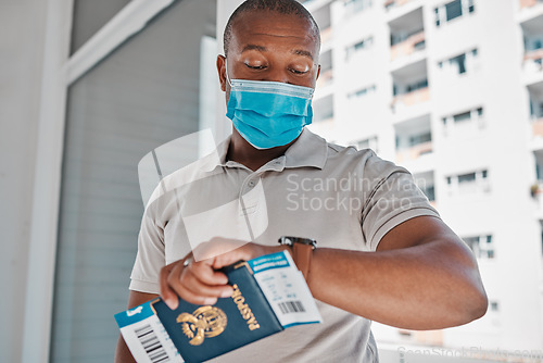 Image of Covid, immigration and passport man with face mask for corona virus and travel restrictions or airport delay. Black man checking time and late due document problem, covid 19 compliance and regulation