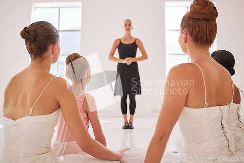 Image of Ballet teacher, woman coach teaching or coaching students dancer in professional studio class in art school. Motivation, trust and leadership artist in creative education speaking to group of women