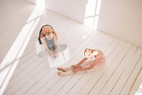 Image of Ballet stretching, dance student and teacher in studio for theatre performance, dancing education and creative art learning from above. Young girl training with mentor for dancer practice and class