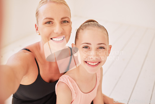 Image of Family, dance and ballet with a mother and her young daughter taking a selfie in a dancing studio for the performing arts. Portrait of a child ballerina and her parent training for a recital or show
