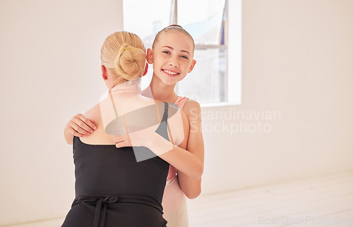 Image of Ballet teacher giving happy student hug at dance studio, girl learning dancing art at school with coach and training for professional performance. Portrait of girl and woman hugging for motivation