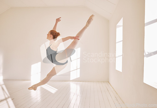 Image of Ballet, jump and performance dance studio with young student. Dancer girl with energy in isolated classroom and moving in the air. Beautiful woman ballerina with strong body and stunning posture.