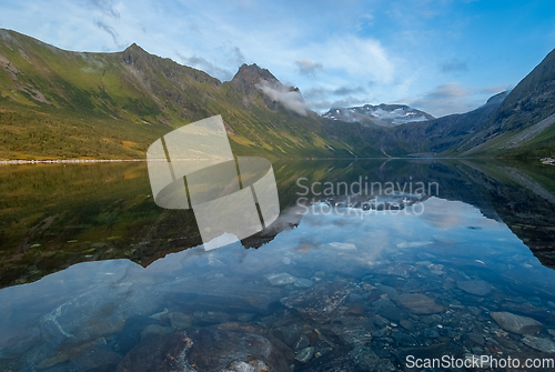 Image of Tranquil Mountain Lake Reflection at Dusk in a Serene Valley