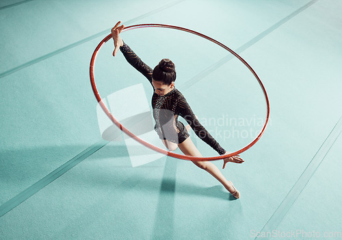 Image of Gymnastics woman with ring for training, fitness and exercise or workout. Gymnast girl at sport competition event in gym or gymnastic center with motivation, goal and winner mindset top view