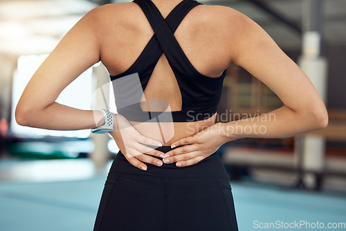 Image of Exercise pain, workout and fitness sports woman with a back injury after training at a boxing gym. Wellness, health or yoga club with a sport athlete person holding her body from joint inflammation